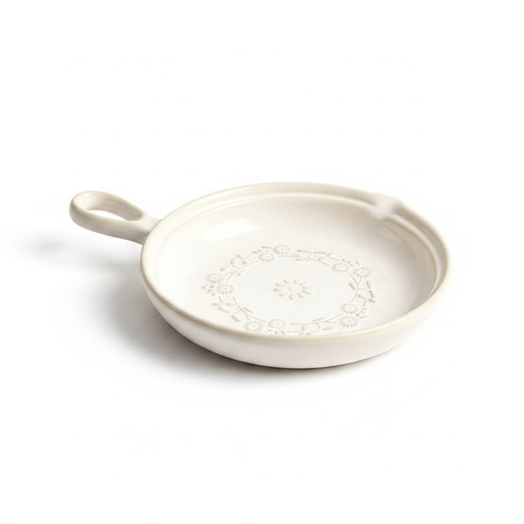 Ghirlanda cream ceramic single-handle serving dish with raised daisy-wreath relief on white