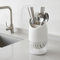 Utensil organizer holding cutlery on a modern kitchen counter