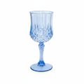 Vintage blue plastic wine goblet with diamond-cut crystal-look pattern on white background