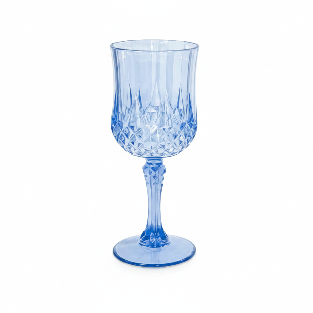 Vintage blue plastic wine goblet with diamond-cut crystal-look pattern on white background