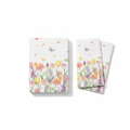Stack of rectangular tulip spring floral paper guest napkins fanned on a white background
