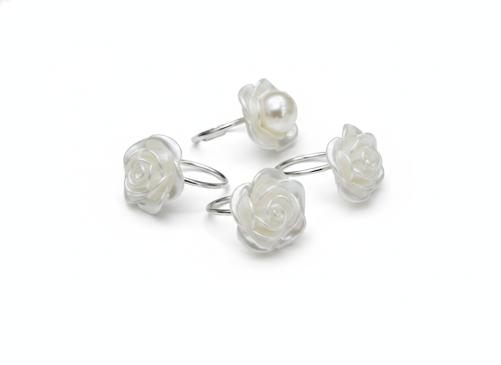 Floral pearl napkin rings with white rose and pearl accent on white background