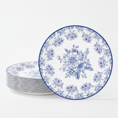 Stack of blue and white chinoiserie floral paper plates on white background