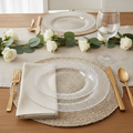 Clear disposable plastic plates place setting — crystal-clear translucent plastic plates with swirled rim, gold flatware