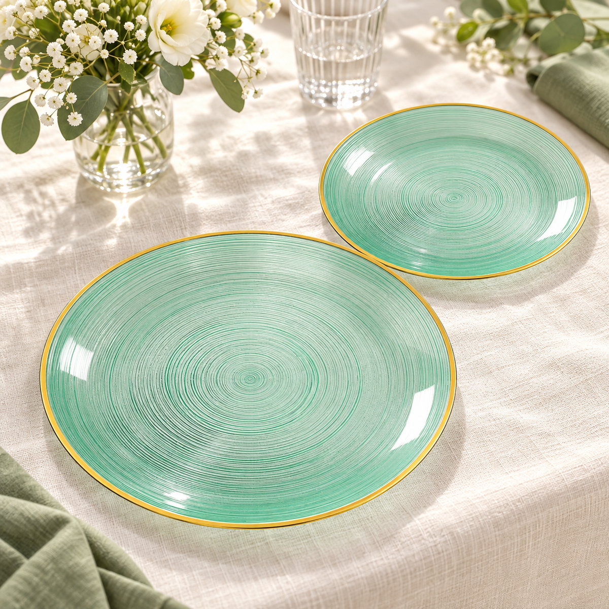 Transparent emerald plates with spiral grooves and a gold rim, bright two-size party pair. Food and styling props not included.