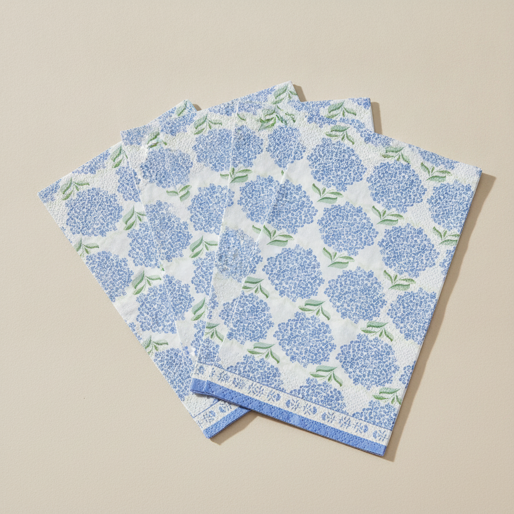 Close-up of blue hydrangea floral pattern on matte paper napkins