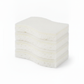Stack of white dual-layer non-scratch cellulose scrub sponges on white