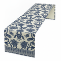 Blue chinoiserie floral table runner draped on a clean white surface