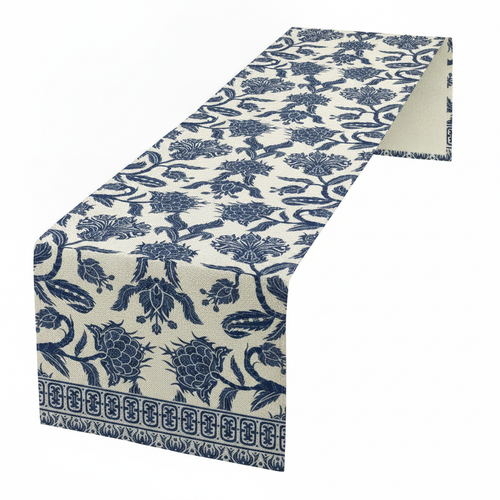 Blue chinoiserie floral table runner draped on a clean white surface
