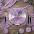 Lilac cheesecloth napkin gathered on a plate in a boho place setting