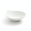 Petalo sculptural matte white porcelain salad bowl with organic petal silhouette on white