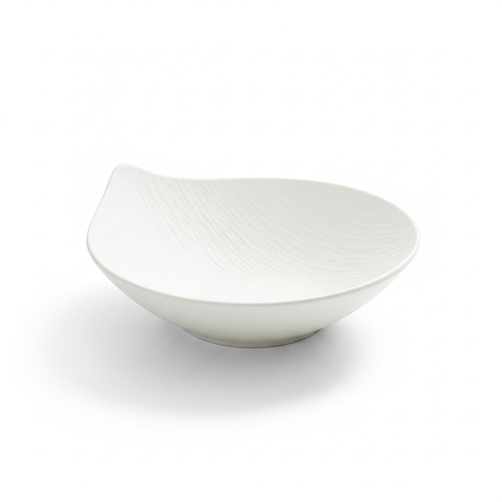 Petalo sculptural matte white porcelain salad bowl with organic petal silhouette on white