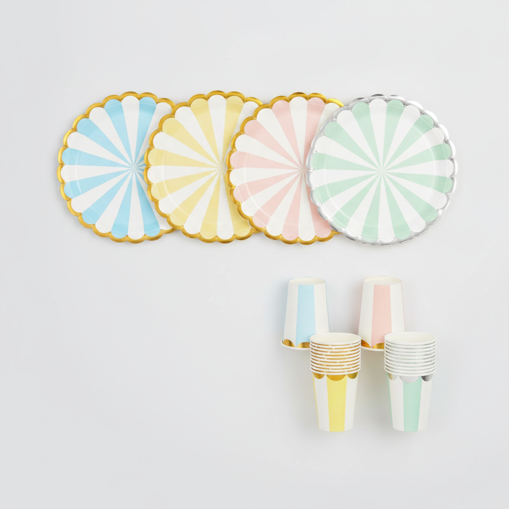 Overhead flat-lay of pastel striped scalloped paper plates and cups in four colorways
