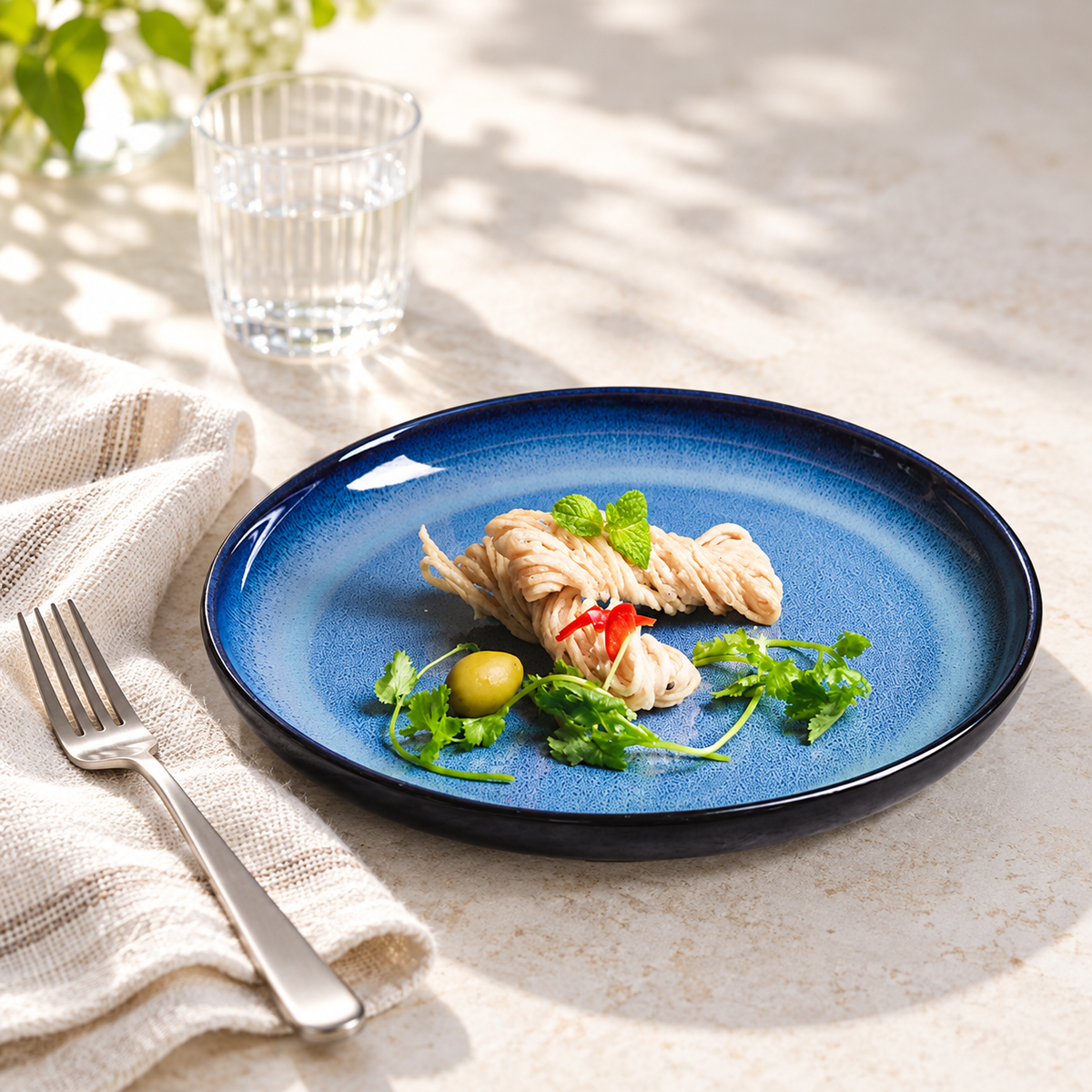 Blue gradient porcelain plate styled for a light lunch; food and accessories not included