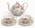Blue Rose Chintz five-piece teapot, two cups and two saucers on a clean studio background