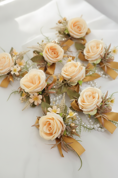 Set of 6 champagne silk rose wedding wrist corsages on white background