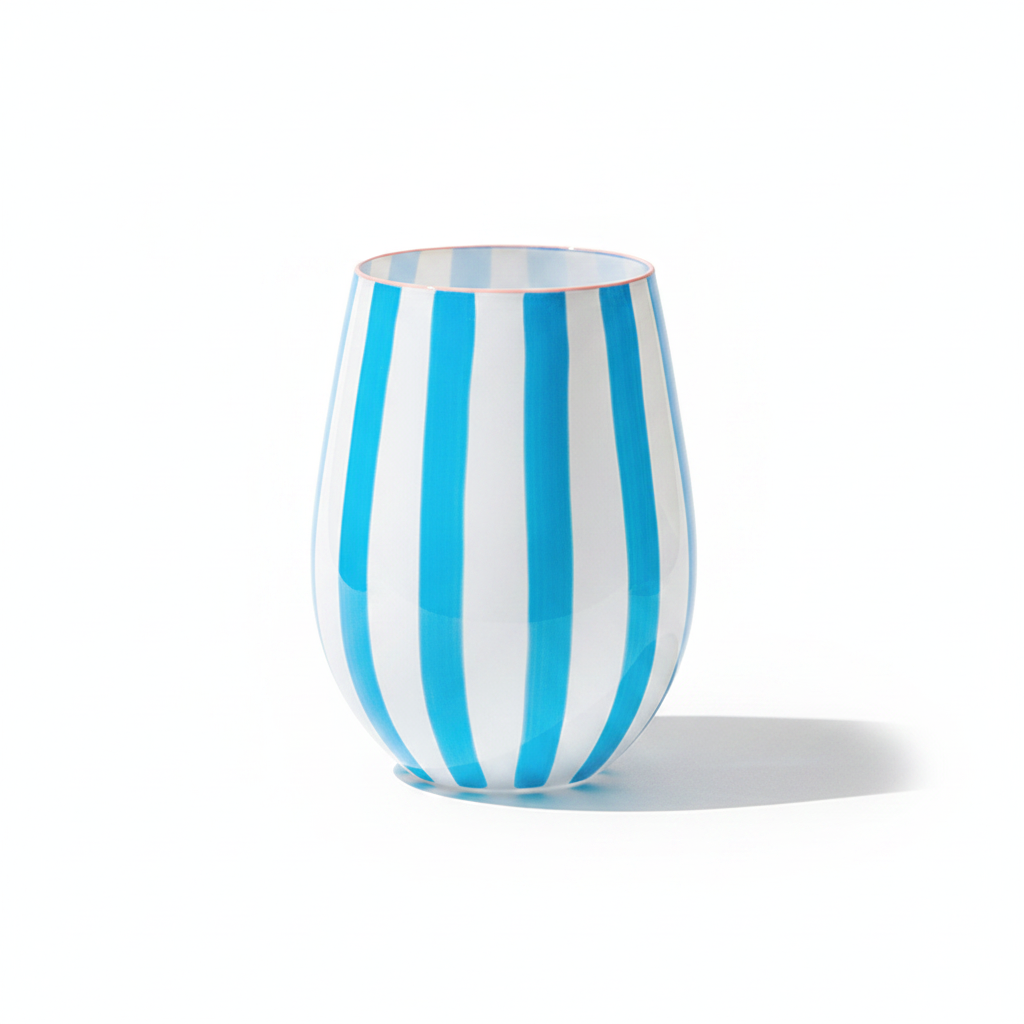 Riga hand-painted striped stemless glass tumbler in blue and white on a white background