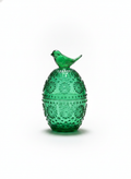 Green egg-shaped embossed glass jar with a sculpted bird finial on white background