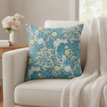 Blue floral peach-skin throw cushion styled on a cream sofa — Maison's Kitchen