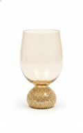 Scintilla diamond-encrusted amber crystal wine glass on white background