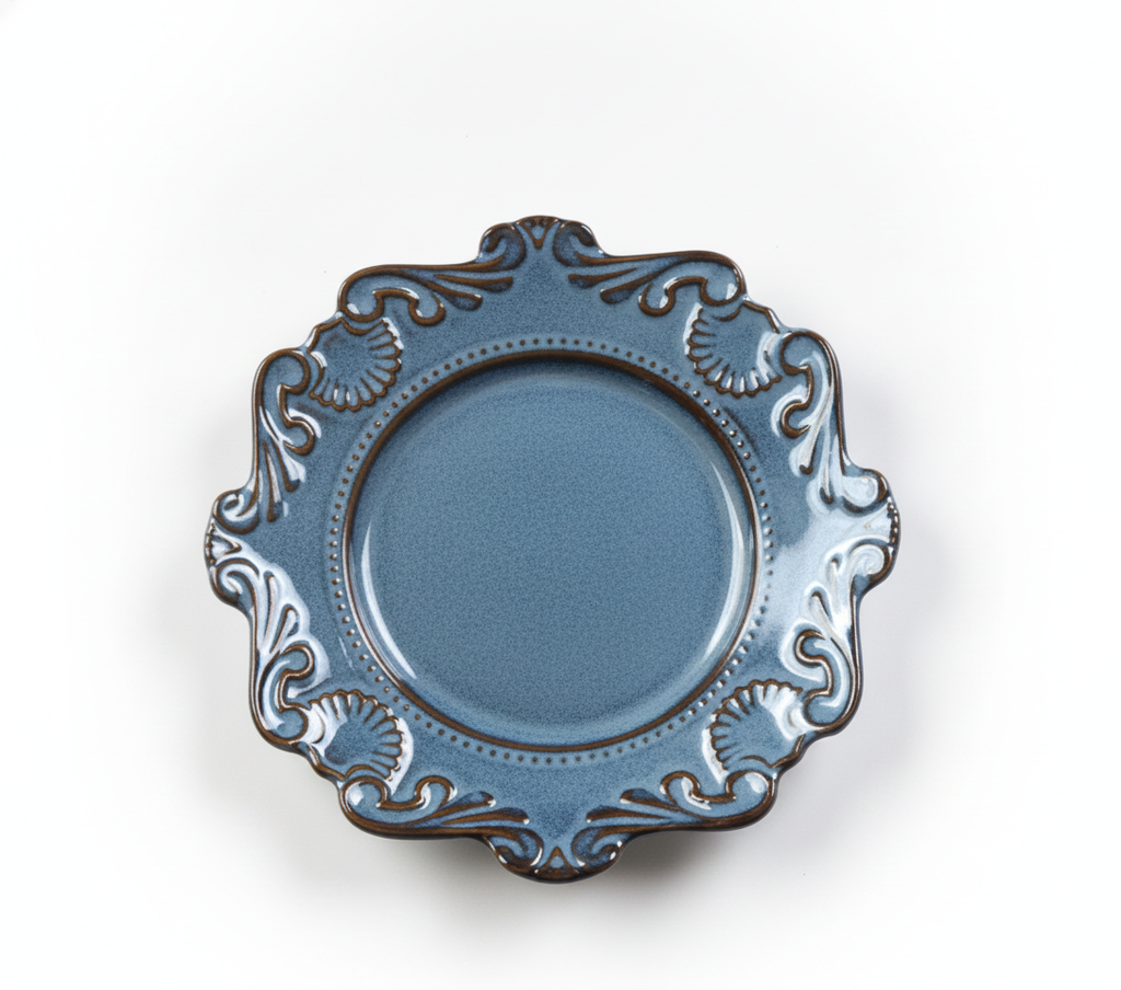 Reactive blue-grey baroque porcelain plate with ornate scalloped rim on white background