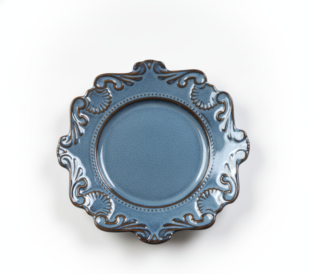 Reactive blue-grey baroque porcelain plate with ornate scalloped rim on white background