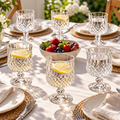 Six diamond-pattern goblets at a sunny brunch table