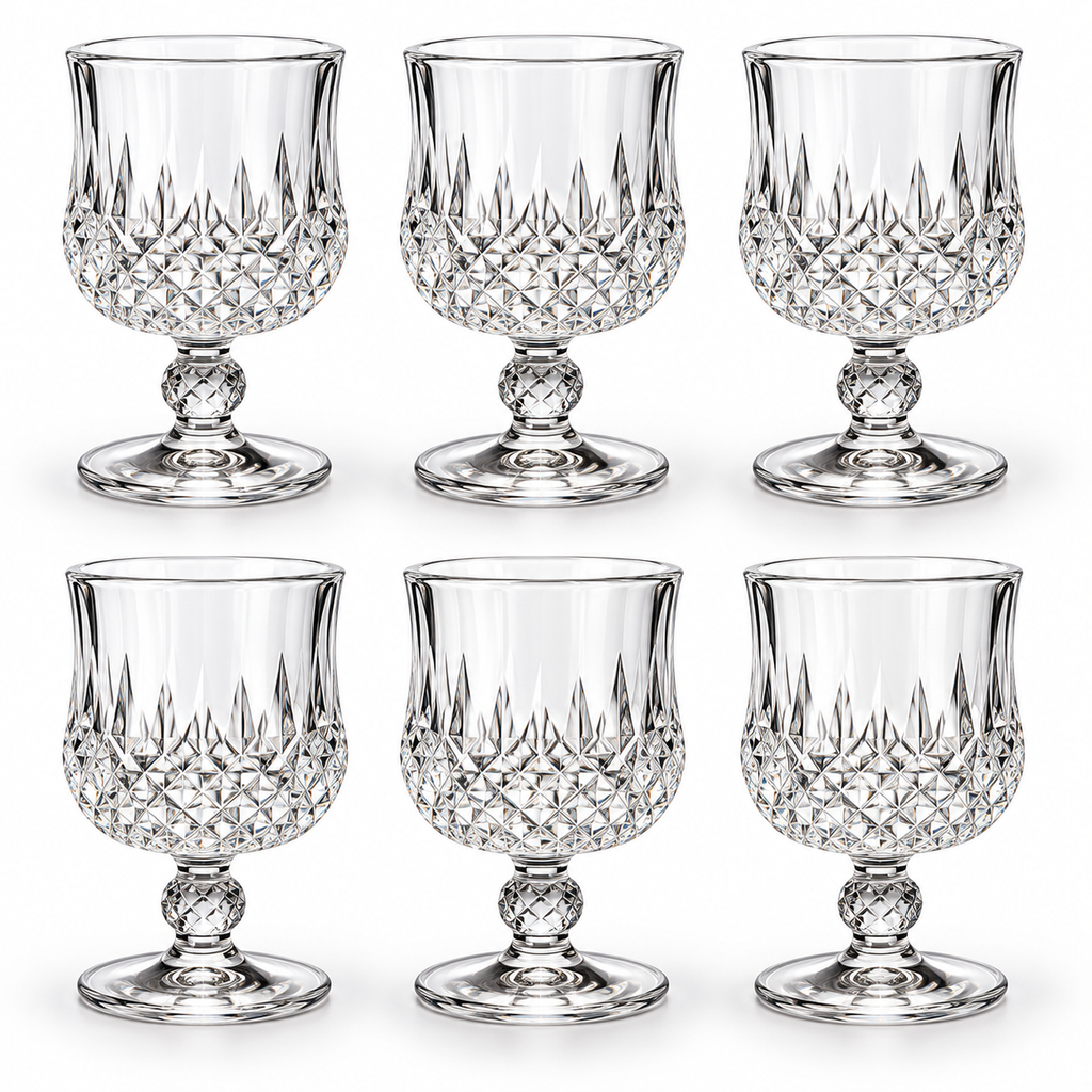 Set of six empty diamond-pattern goblets on white