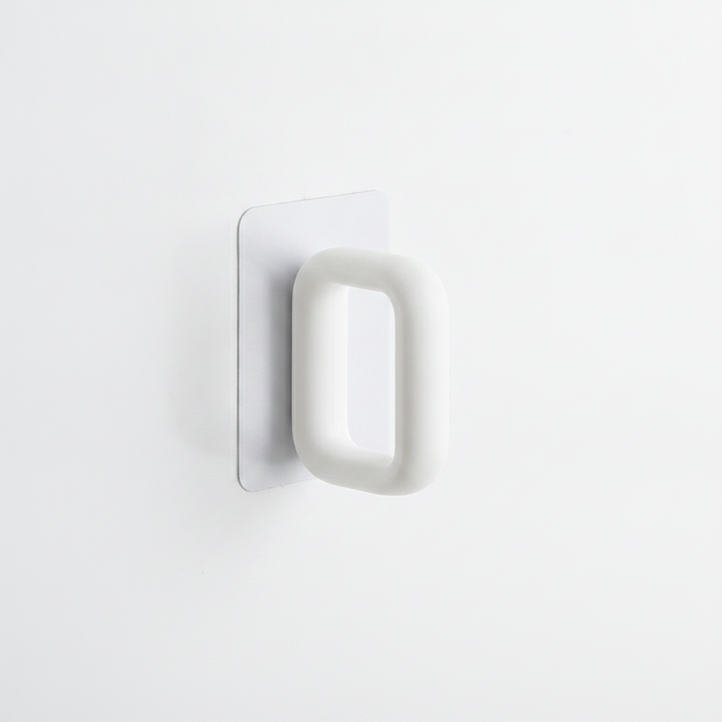 Macro detail of the white plastic bar holder and adhesive mount of the organizer