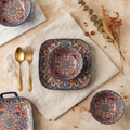 Bohemian mandala hand-glazed ceramic bowls and plates, overhead editorial place-setting on Mediterranean styling