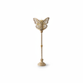 Farfalla hand-forged butterfly candlestick with pierced openwork wings and antiqued cream finish on white