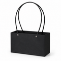 Single empty black cardstock floral tote with tall loop handles on a white background.