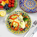 Bohemian ceramic plates in a salad and fruit table setting; food and utensils not included