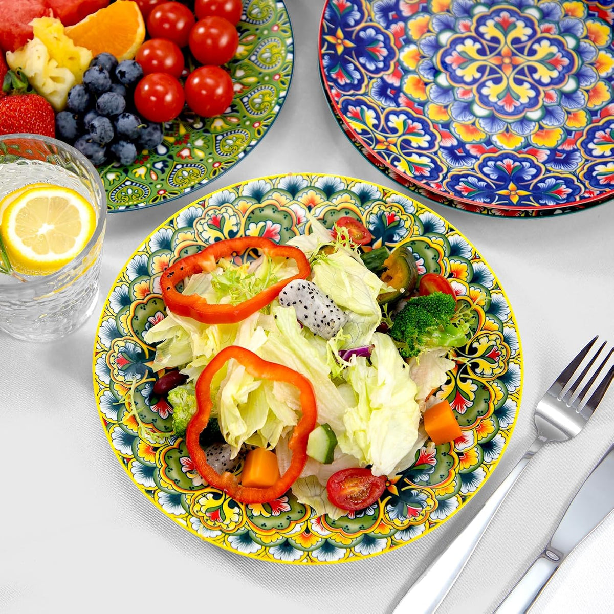 Bohemian ceramic plates in a salad and fruit table setting; food and utensils not included
