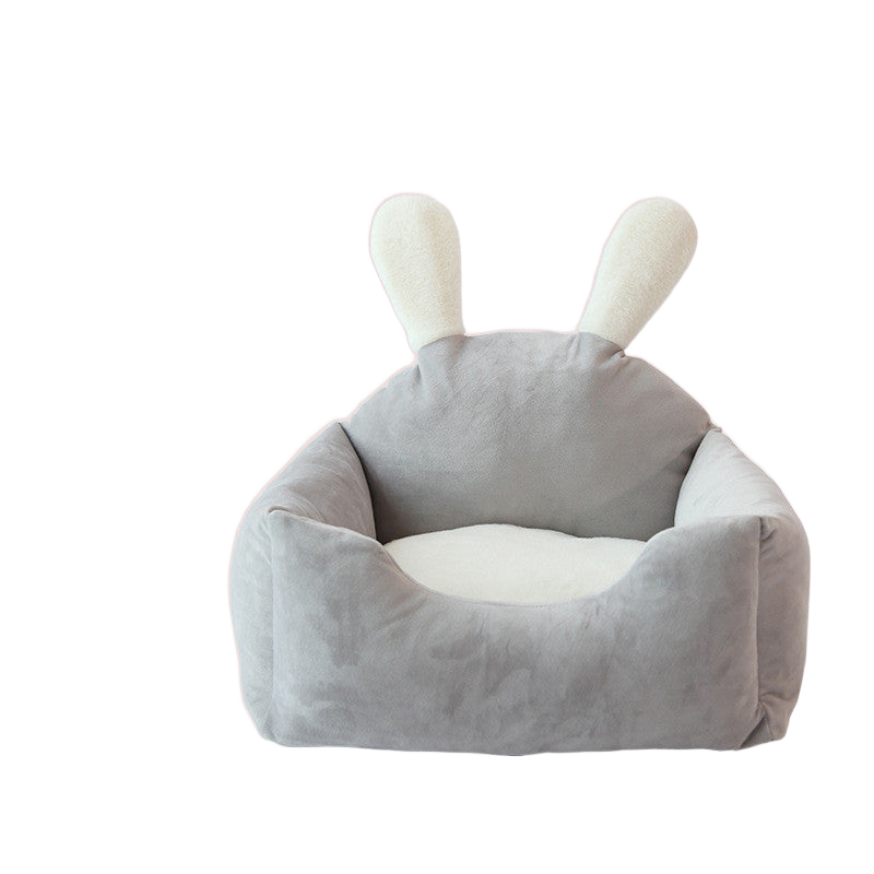 Gray bunny-eared cozy pet bed with plush cushion on white background