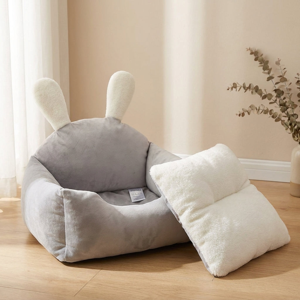 Gray bunny-eared pet bed with the removable washable cushion lifted out