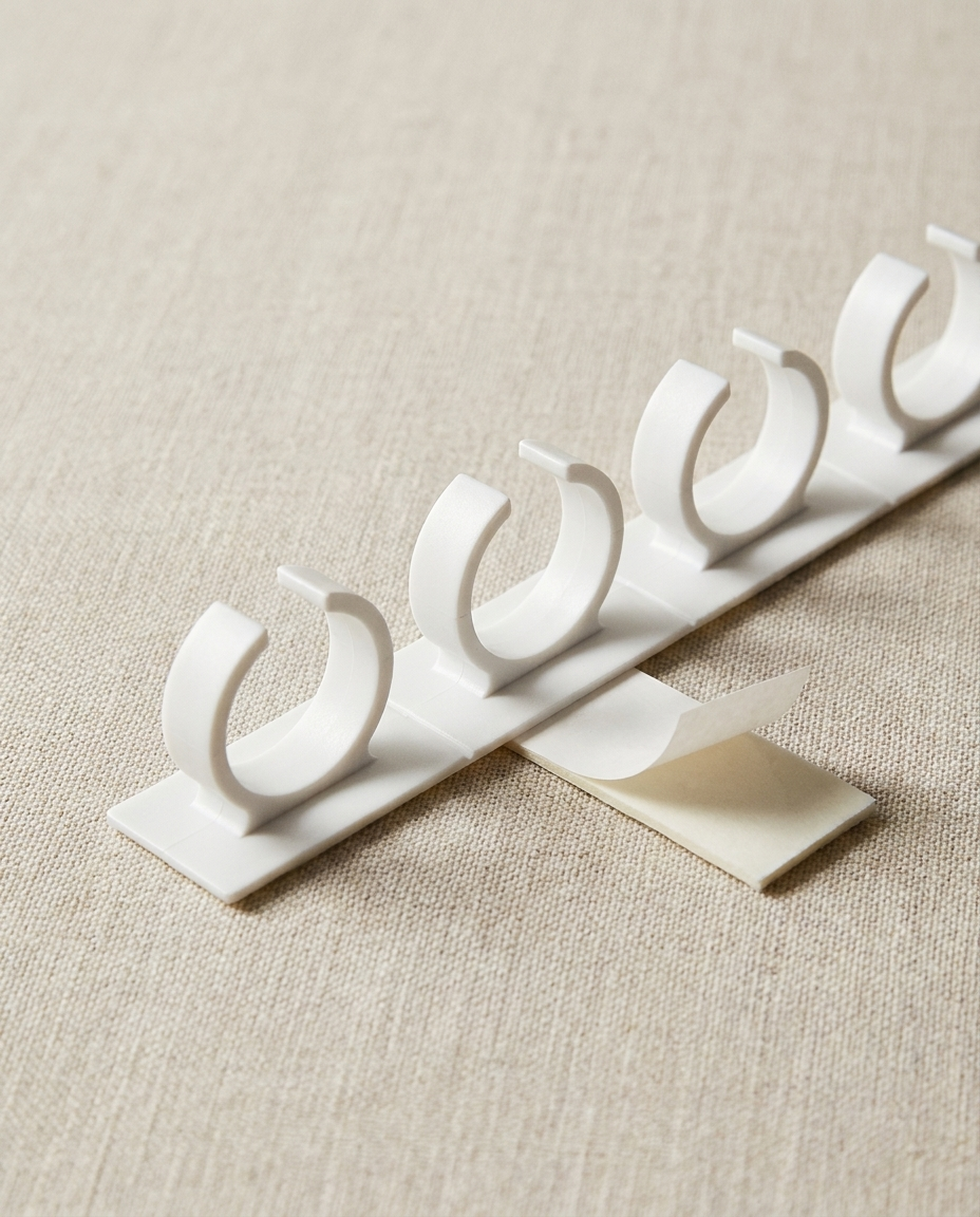 Detail of a single white spice clip strip with five clips