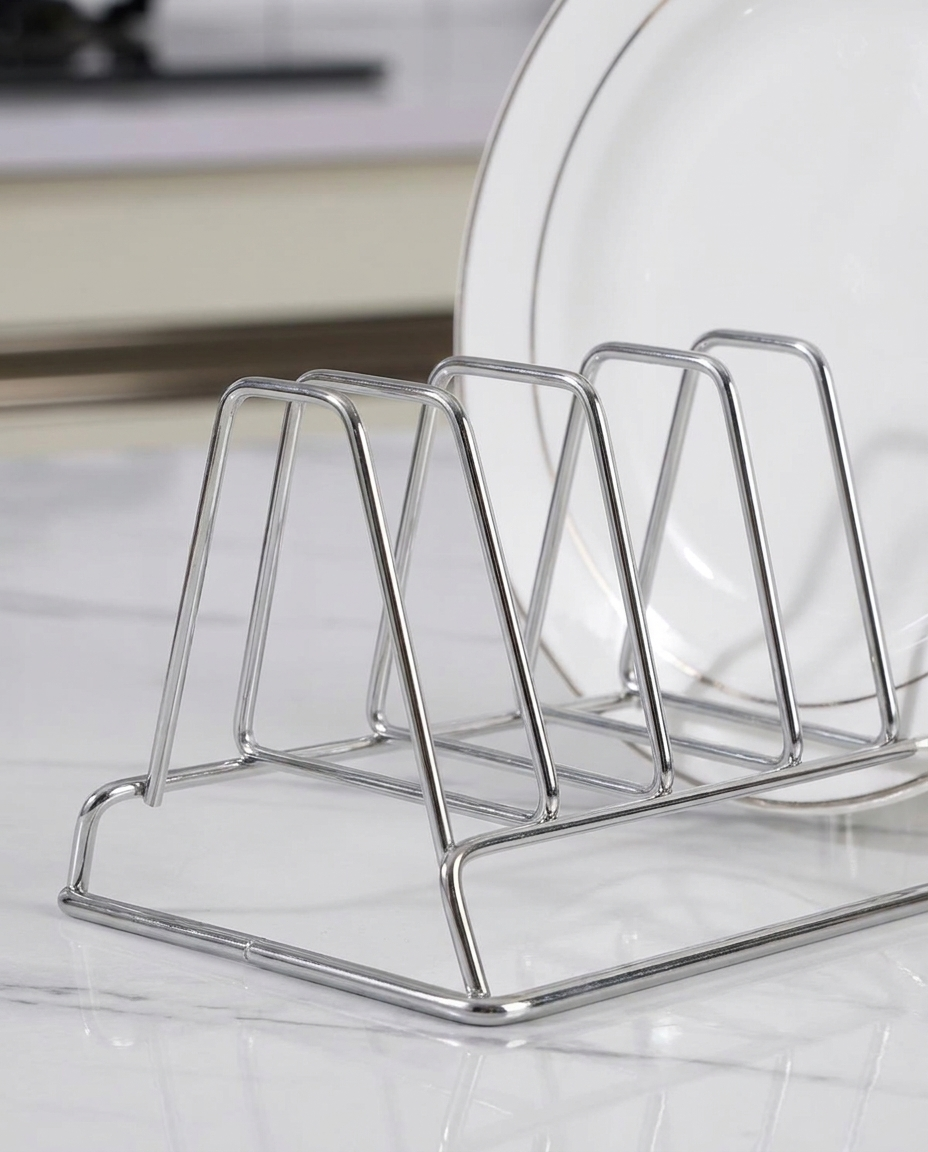 Close-up of polished stainless steel dish rack wires holding a plate