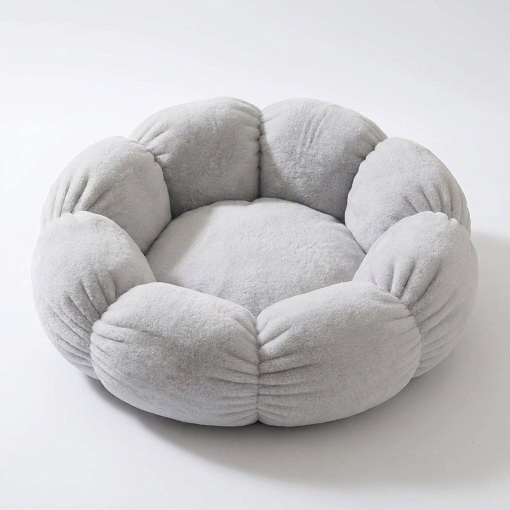 Grey flower-shaped plush pet nest, empty, on a clean white background
