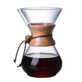 Glass pour-over coffee carafe with wooden collar on pure white background product photo