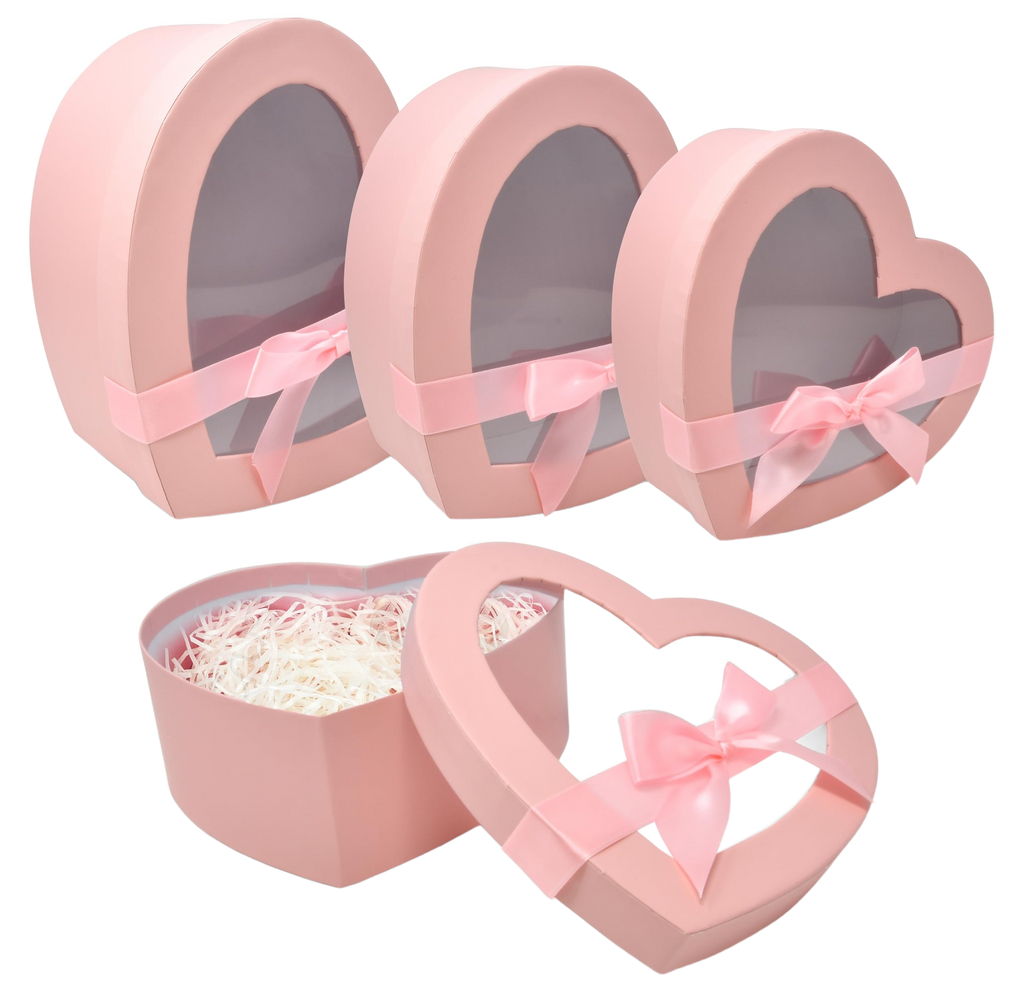 Trio of pink heart-shaped gift boxes with clear windows and pink bows