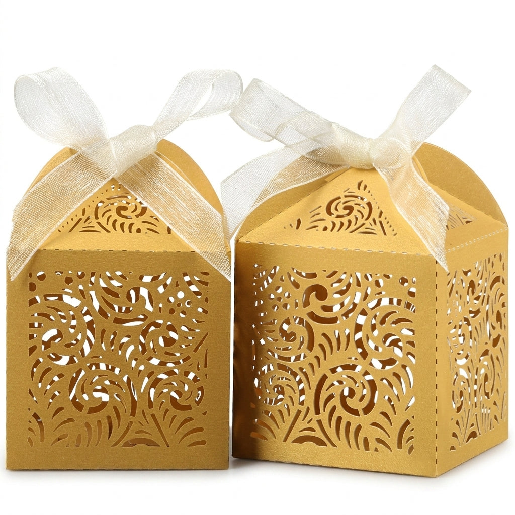 Gold laser-cut filigree favor boxes with cream ribbons