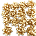 Gold star confetti gift bows on white background
