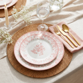 Pink toile plastic plate place setting with gold cutlery and linen napkin
