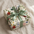Gift wrapped in vintage wildflower paper with sage ribbon