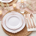 White rose gold place setting with rose gold cutlery, cup and baby's breath