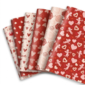 Valentine's red and pink heart and cupid wrapping paper, 12 flat sheets fanned out