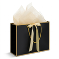 Large black gift bag with gold trim, rope handles, and cream bow