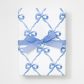 Gift wrapped in blue watercolor bow lattice wrapping paper
