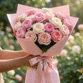 Rose bouquet wrapped in pink waterproof bouquet paper